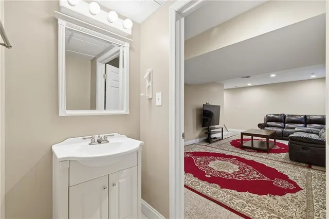 a en suite bathroom with a sink and a mirror