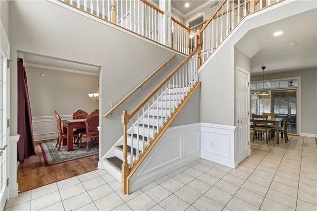 a view of entryway and hall with dining room