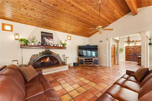 a view of a kitchen with kitchen island a large window in it