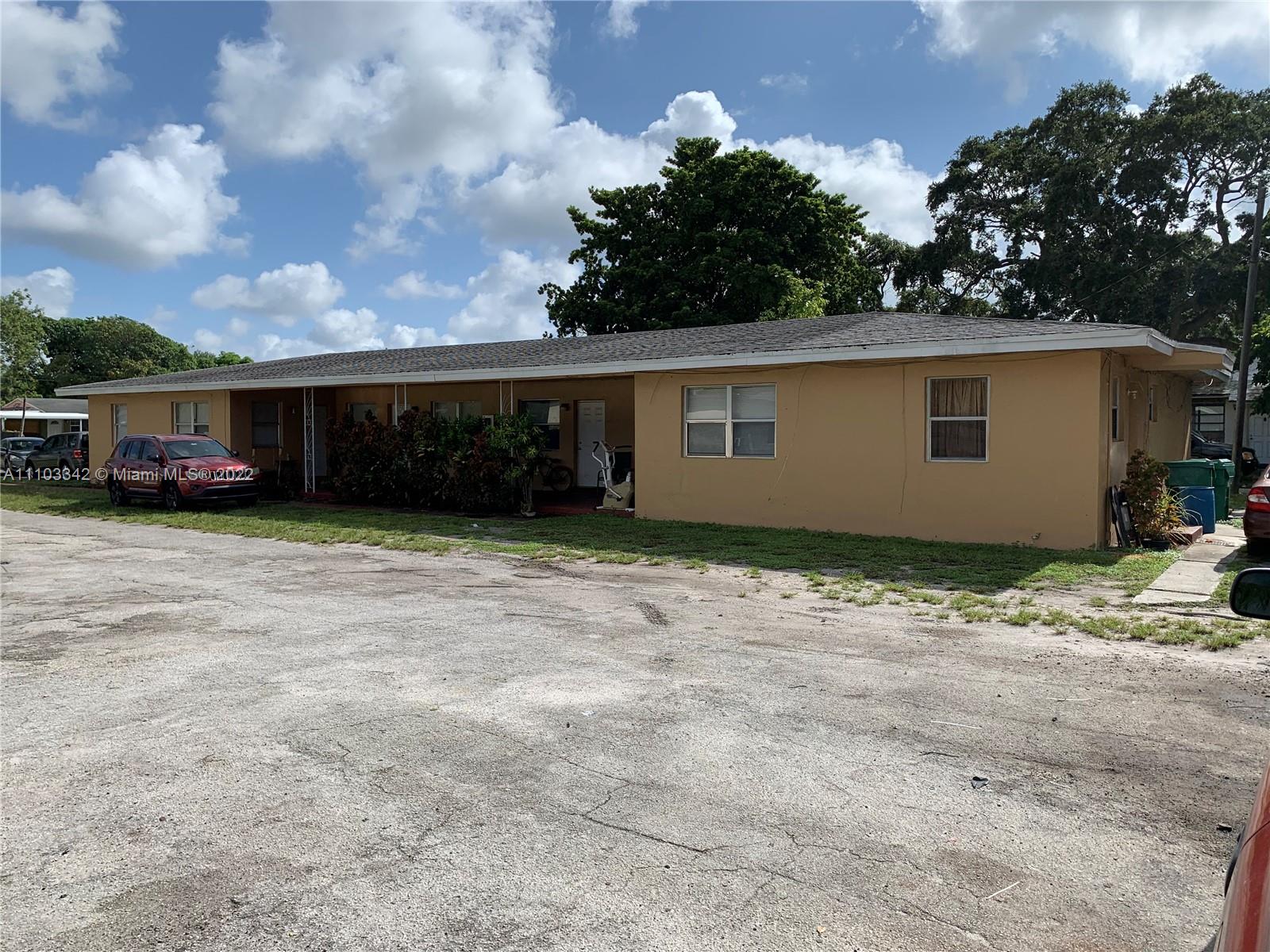 6318 Southwest 25th Street Miramar, FL 33023 - Photo 2 of 6 a view of a house with a yard