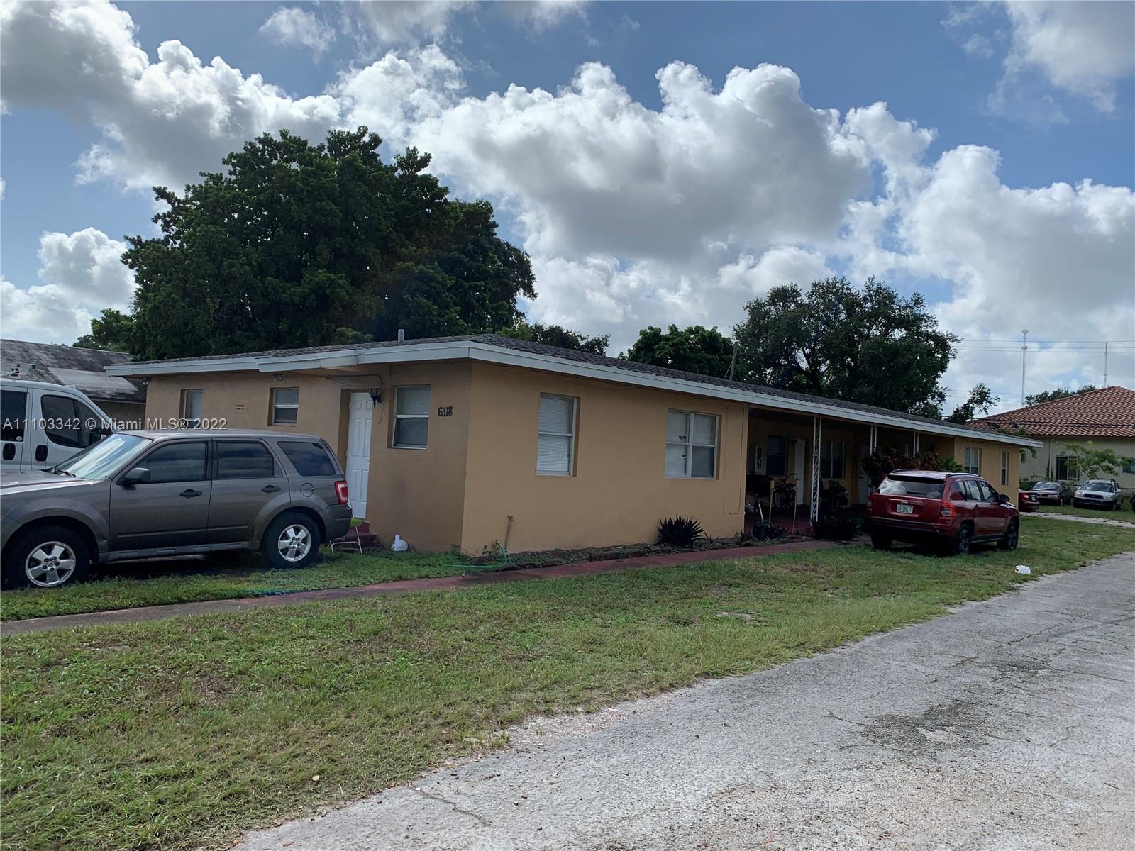 6318 Southwest 25th Street Miramar, FL 33023 - Photo 4 of 6 a view of a car in front of house