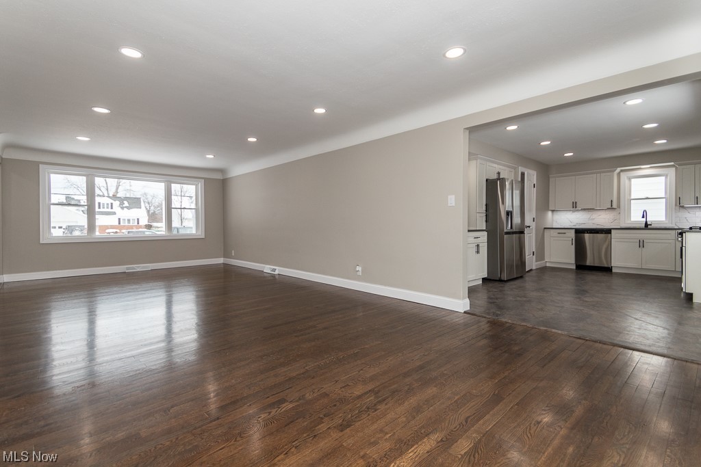 4980 Emmet Road Lyndhurst, OH 44124 - Photo 7 of 39 Unfurnished living room featuring dark hardwood / wood-style flooring