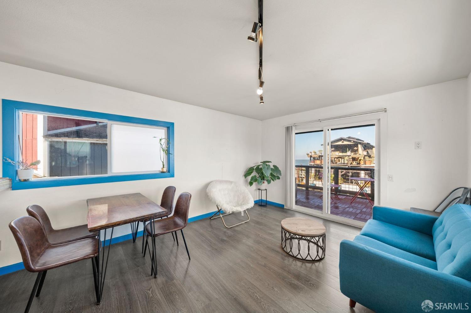 1900 Stenmark Drive, Unit 3302 Richmond, CA 94801 - Photo 3 of 10 a living room with furniture and wooden floor