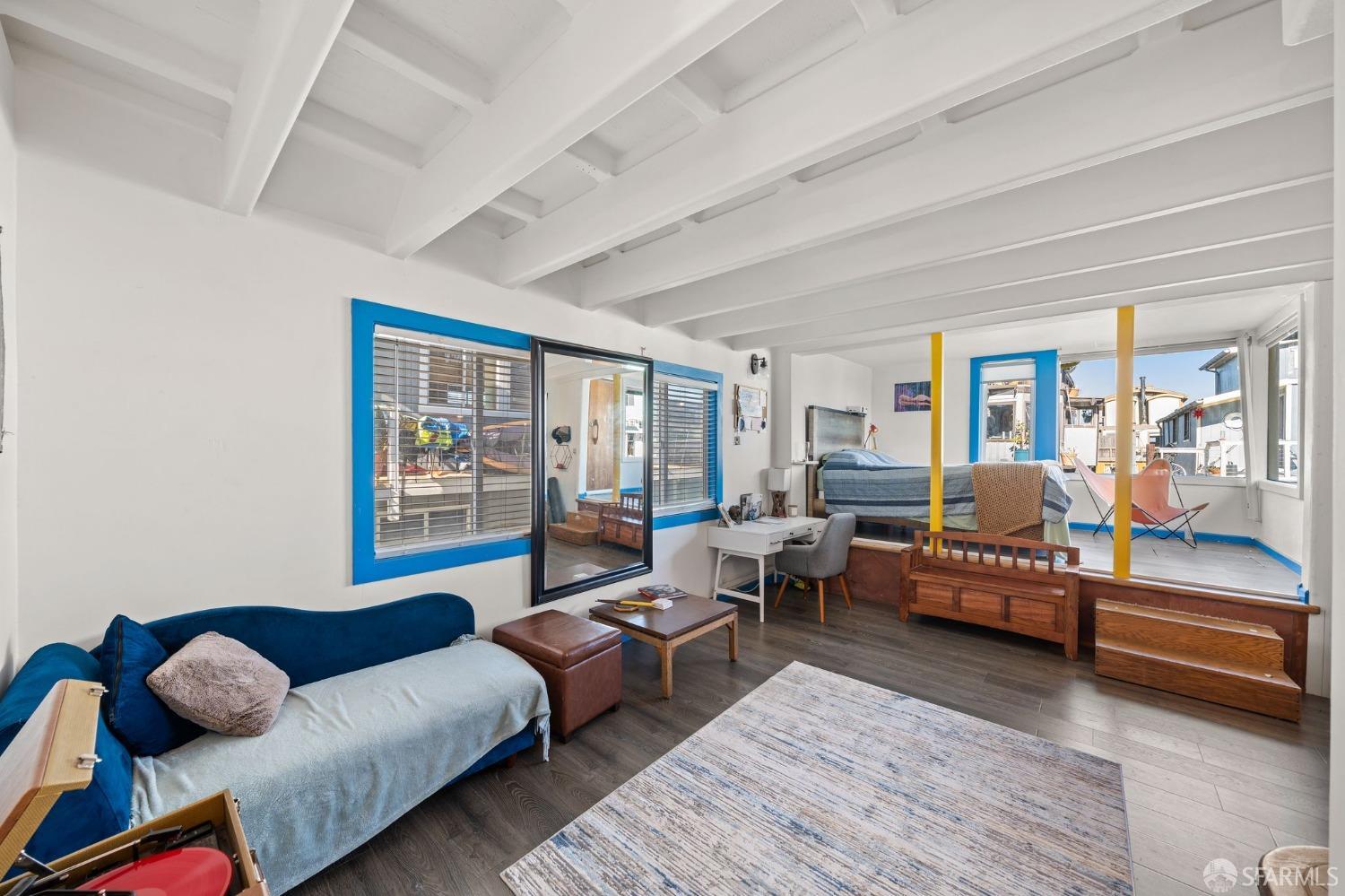 1900 Stenmark Drive, Unit 3302 Richmond, CA 94801 - Photo 4 of 10 a living room with furniture and a large window