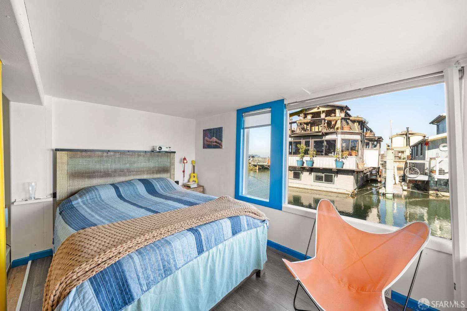 1900 Stenmark Drive, Unit 3302 Richmond, CA 94801 - Photo 5 of 10 a bedroom with furniture and a large window