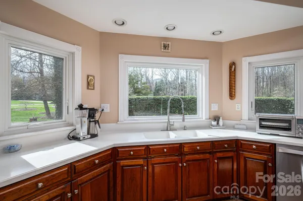 a kitchen with sink and window