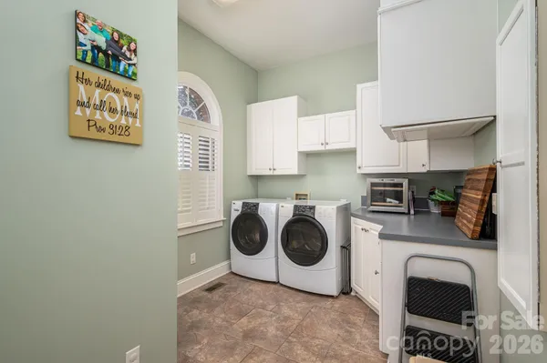 a kitchen with a cabinets and a stove top oven