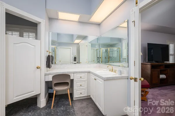 a view of a sink and a refrigerator in a room