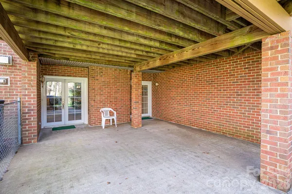 a view of a room with large windows
