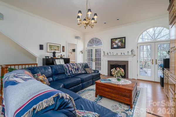 a living room with furniture fireplace and window