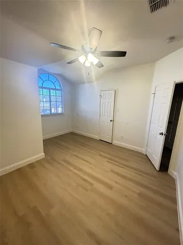 a view of a bathroom with tub and mirror