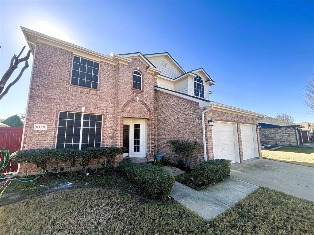 3112 Mason Avenue Corinth, TX 76210 - Photo 2 of 21 a front view of a house with garden