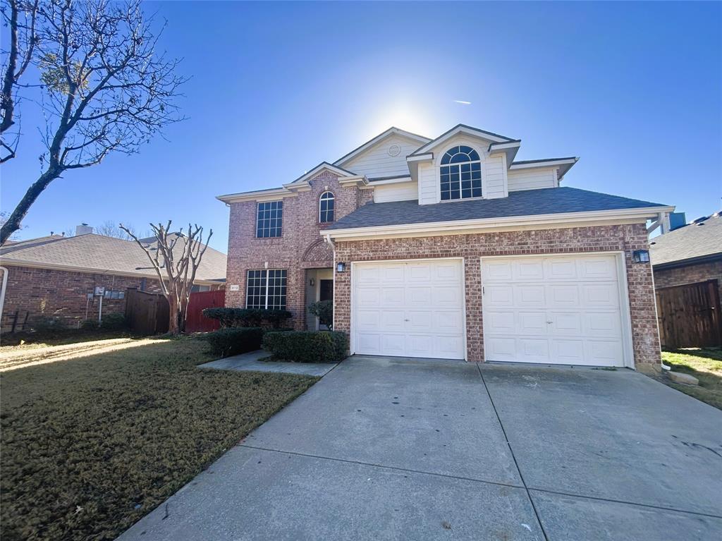 3112 Mason Avenue Corinth, TX 76210 - Photo 3 of 21 a front view of a house with a yard and garage