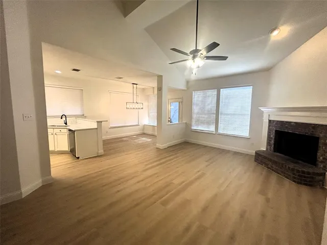a kitchen with granite countertop a sink stainless steel appliances and cabinets