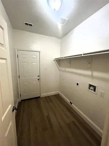 a view of a hallway with staircase