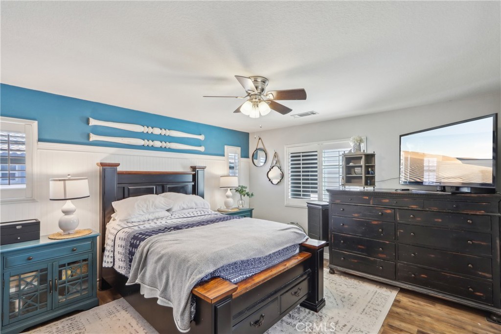 33971 Lily Road Yucaipa, CA 92399 - Photo 13 of 29 a bedroom with a bed and a dresser