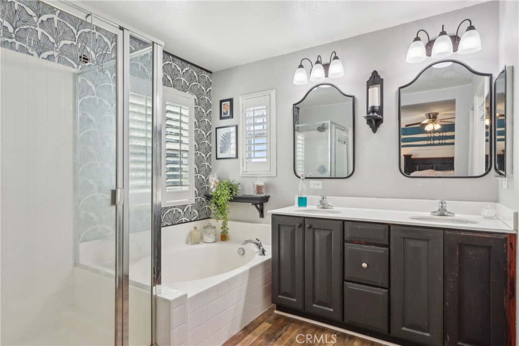 33971 Lily Road Yucaipa, CA 92399 - Photo 15 of 29 a bathroom with a double vanity sink mirror and bathtub