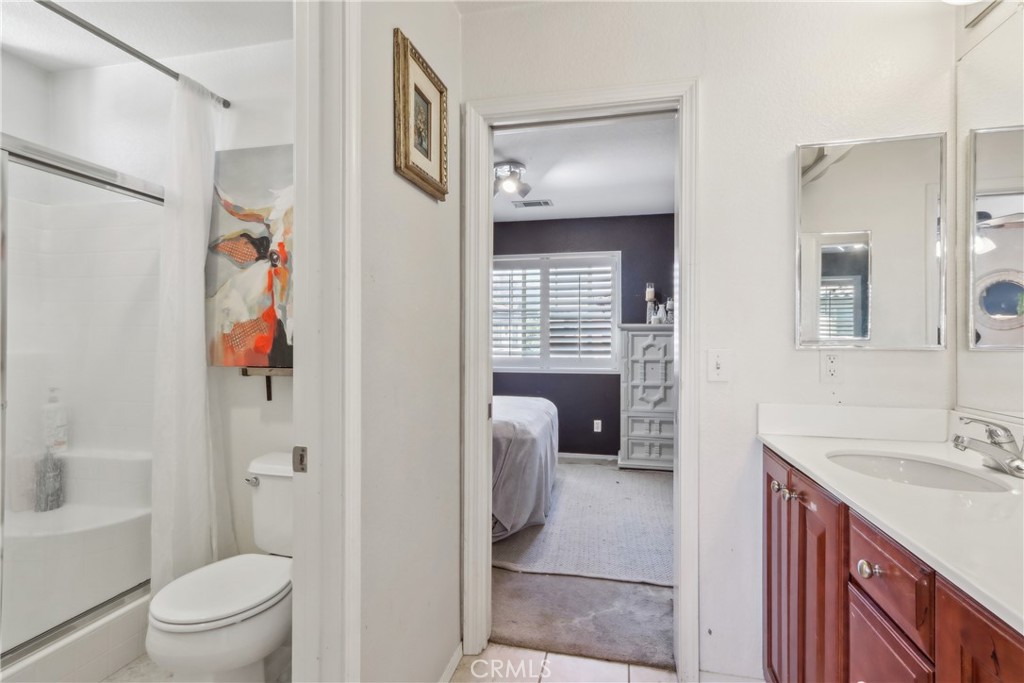 33971 Lily Road Yucaipa, CA 92399 - Photo 19 of 29 a bathroom with a sink a toilet and shower