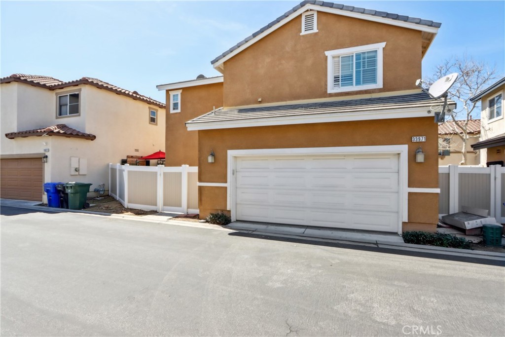 33971 Lily Road Yucaipa, CA 92399 - Photo 23 of 29 a front view of a house with a garage