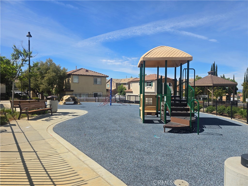 33971 Lily Road Yucaipa, CA 92399 - Photo 29 of 29 a backyard of a house with barbeque oven table and chairs