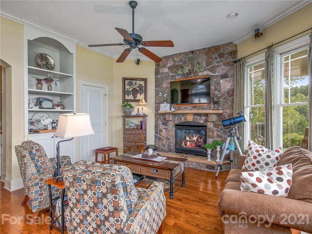 3043 John Watson Road Rutherfordton, NC 28139 - Photo 13 of 48 a living room with furniture and a fireplace
