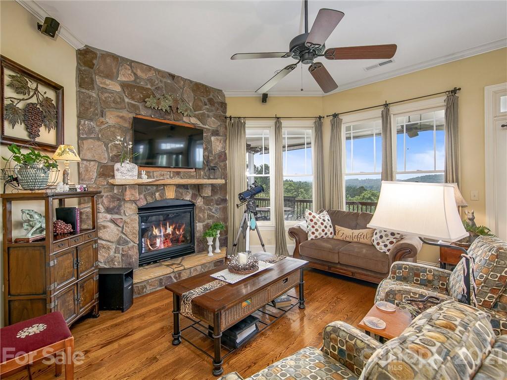 3043 John Watson Road Rutherfordton, NC 28139 - Photo 14 of 48 a living room with furniture a flat screen tv and a fireplace