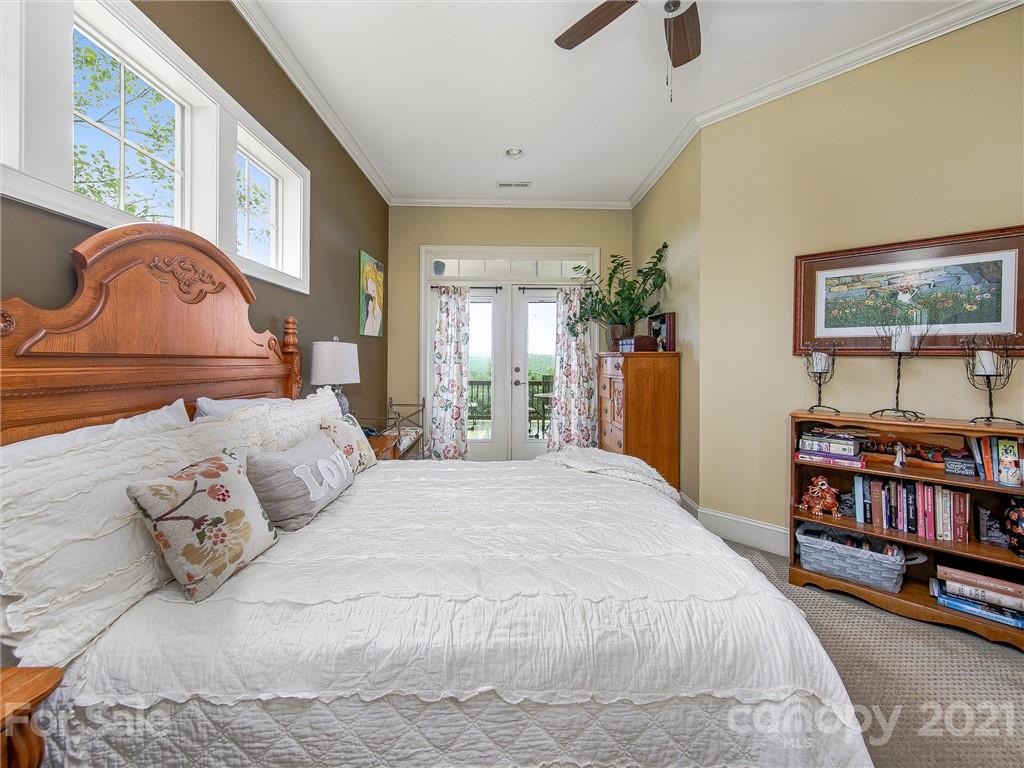 3043 John Watson Road Rutherfordton, NC 28139 - Photo 24 of 48 a bedroom with a bed a dresser and a book shelf
