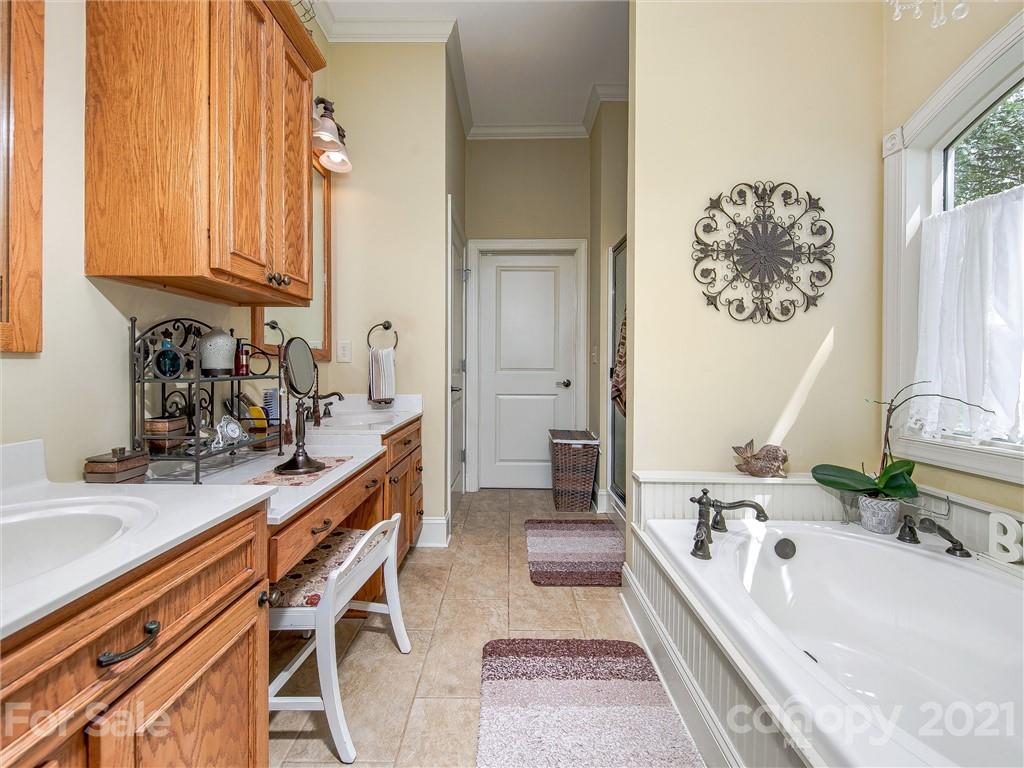 3043 John Watson Road Rutherfordton, NC 28139 - Photo 25 of 48 a bathroom with a tub sink and mirror