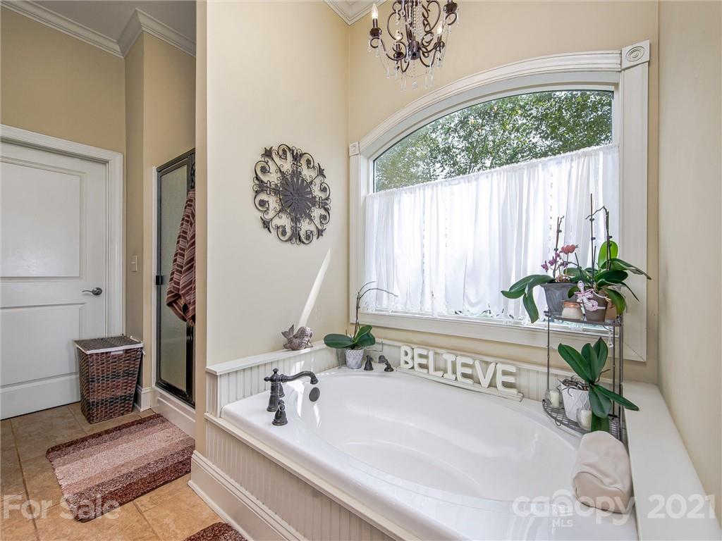 3043 John Watson Road Rutherfordton, NC 28139 - Photo 26 of 48 a bathroom with a bathtub and a sink
