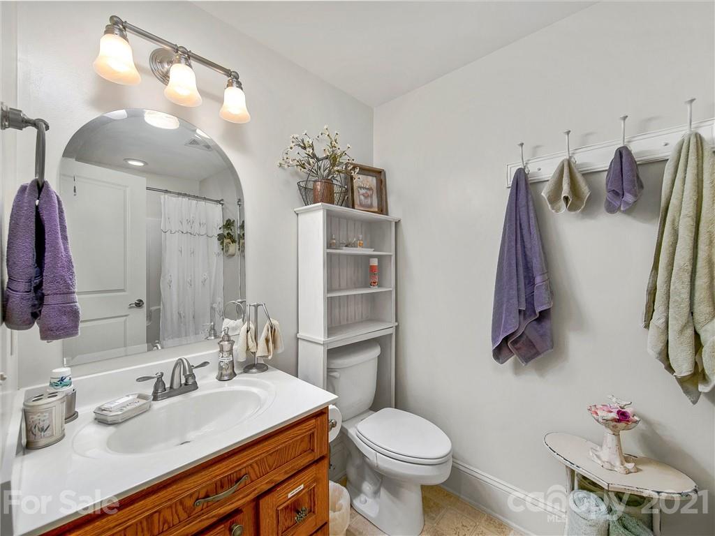 3043 John Watson Road Rutherfordton, NC 28139 - Photo 28 of 48 a bathroom with a sink vanity mirror and toilet
