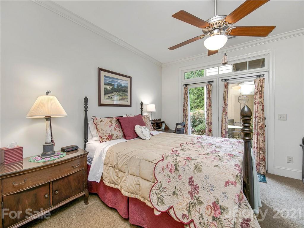 3043 John Watson Road Rutherfordton, NC 28139 - Photo 29 of 48 a spacious bedroom with a bed and a chandelier
