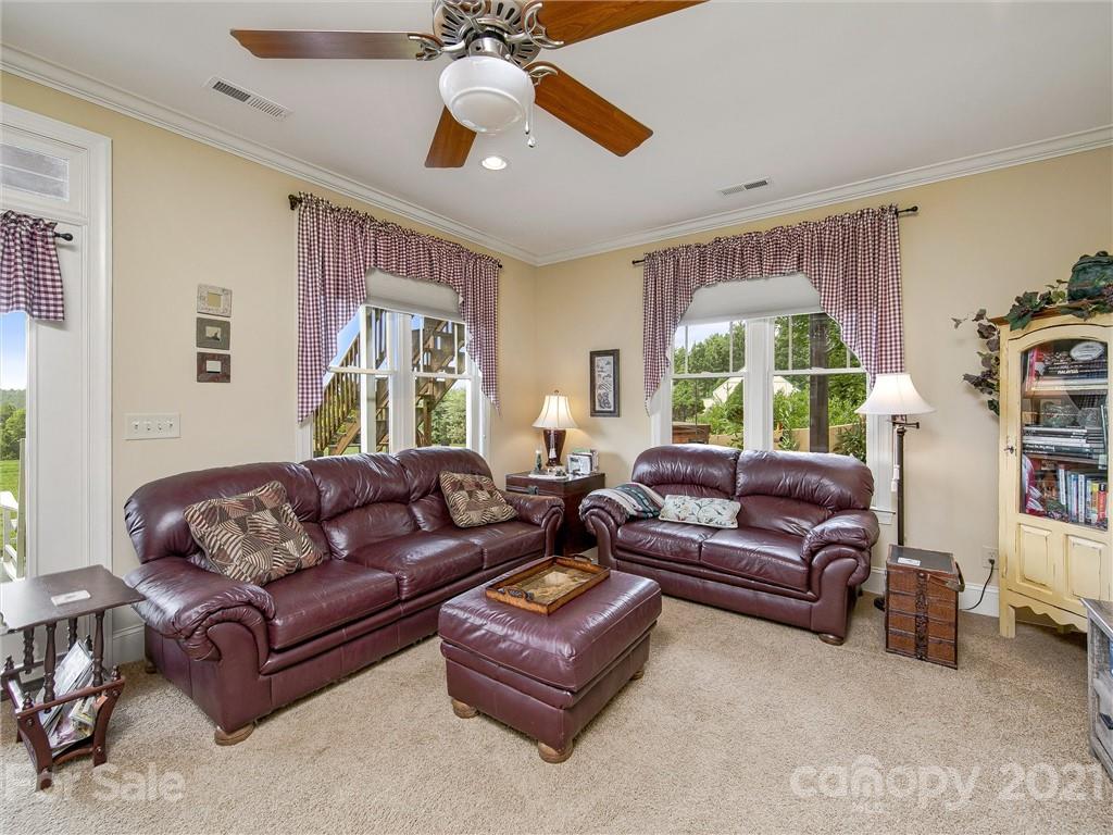 3043 John Watson Road Rutherfordton, NC 28139 - Photo 30 of 48 a living room with furniture ceiling fan and a window