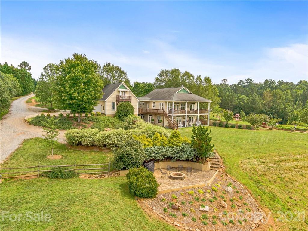 3043 John Watson Road Rutherfordton, NC 28139 - Photo 4 of 48 a view of a lake with a house in the background