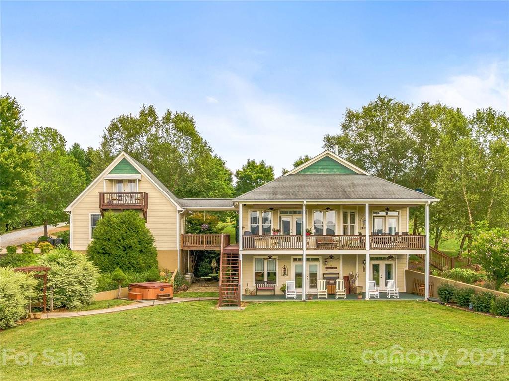 3043 John Watson Road Rutherfordton, NC 28139 - Photo 32 of 48 a front view of a house with a yard table and chairs