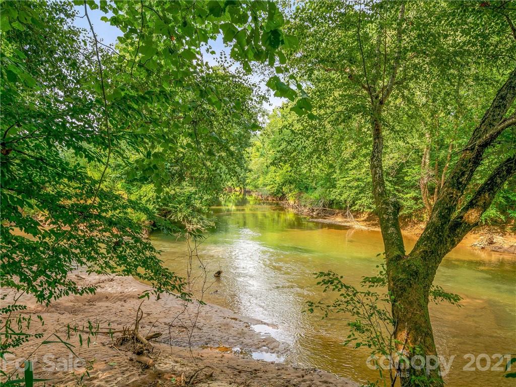 3043 John Watson Road Rutherfordton, NC 28139 - Photo 37 of 48 a view of a lake with a tree
