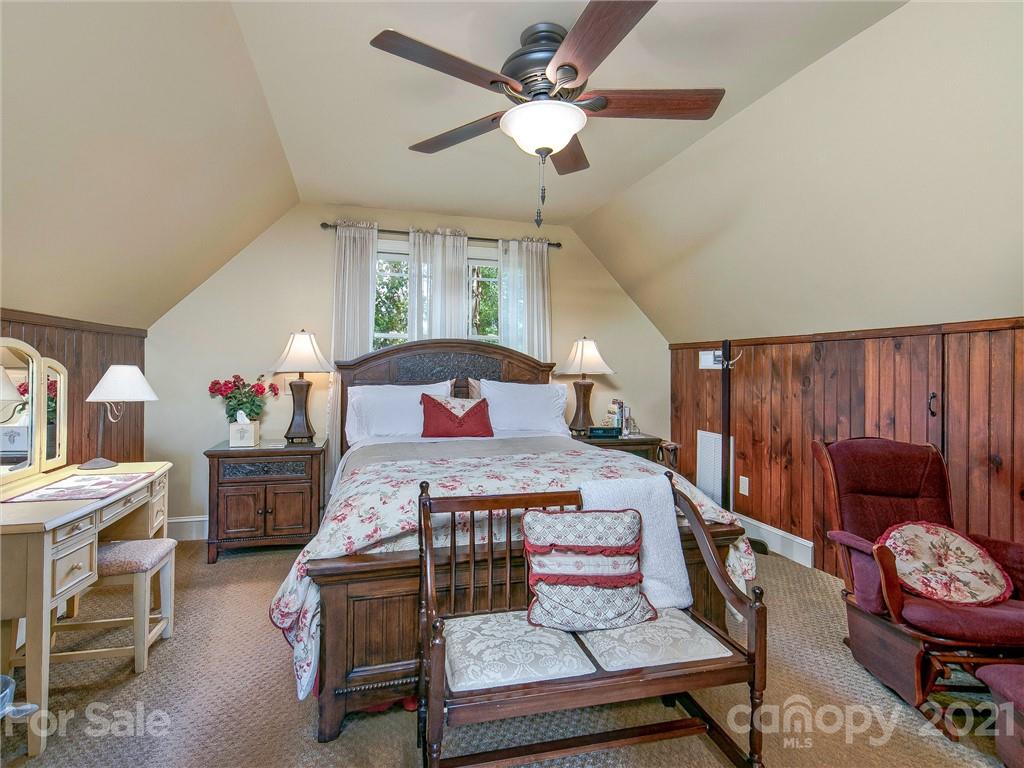 3043 John Watson Road Rutherfordton, NC 28139 - Photo 40 of 48 a bedroom with a bed and a chandelier