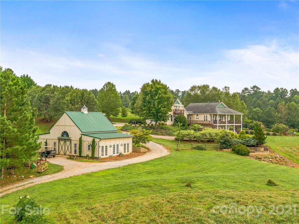 3043 John Watson Road Rutherfordton, NC 28139 - Photo 5 of 48 a view of a house with a big yard and large trees