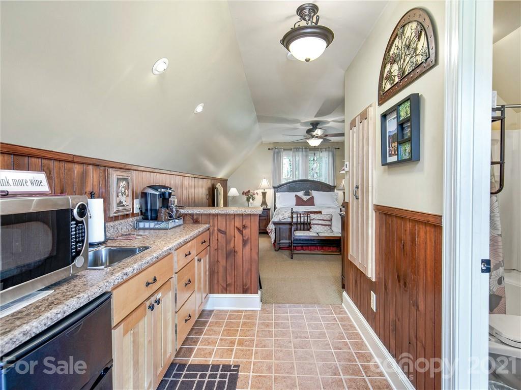 3043 John Watson Road Rutherfordton, NC 28139 - Photo 41 of 48 a kitchen with granite countertop lots of counter top space and furniture