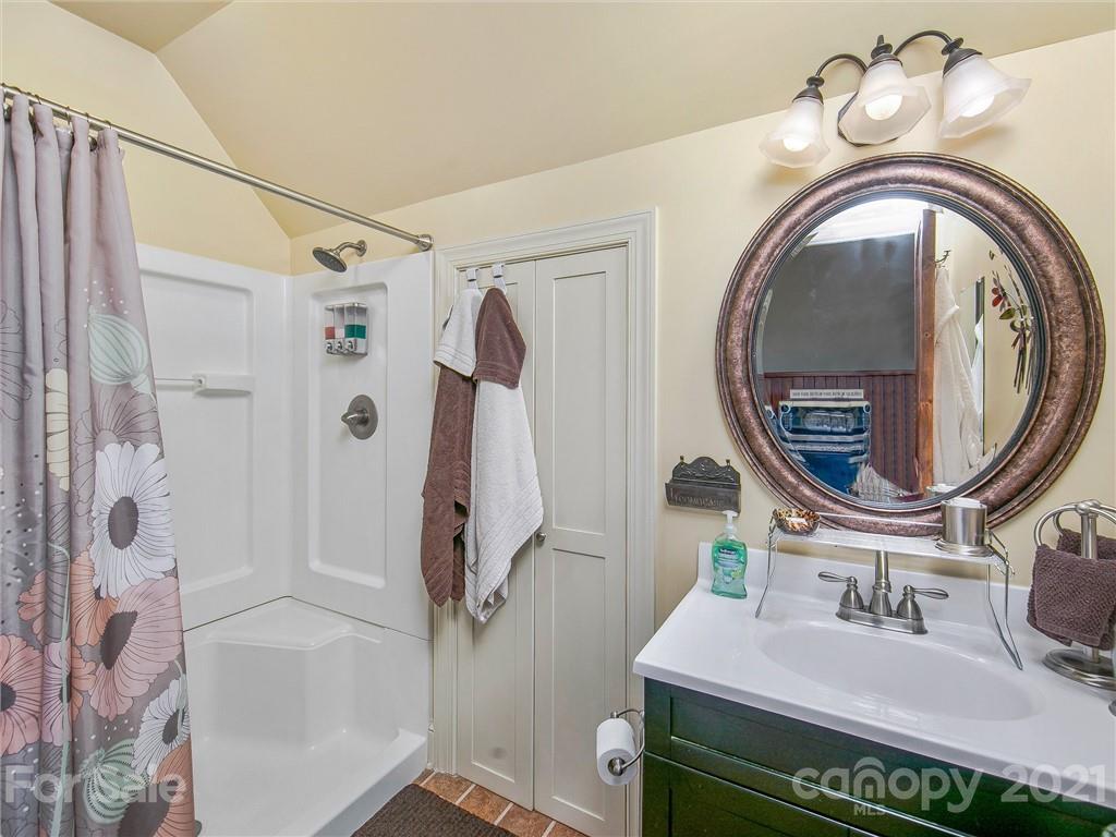 3043 John Watson Road Rutherfordton, NC 28139 - Photo 42 of 48 a bathroom with a sink a toilet and a mirror
