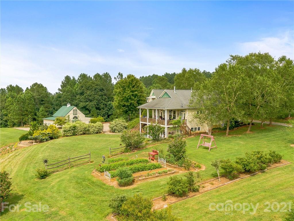 3043 John Watson Road Rutherfordton, NC 28139 - Photo 46 of 48 a view of a big house with a big yard and large trees
