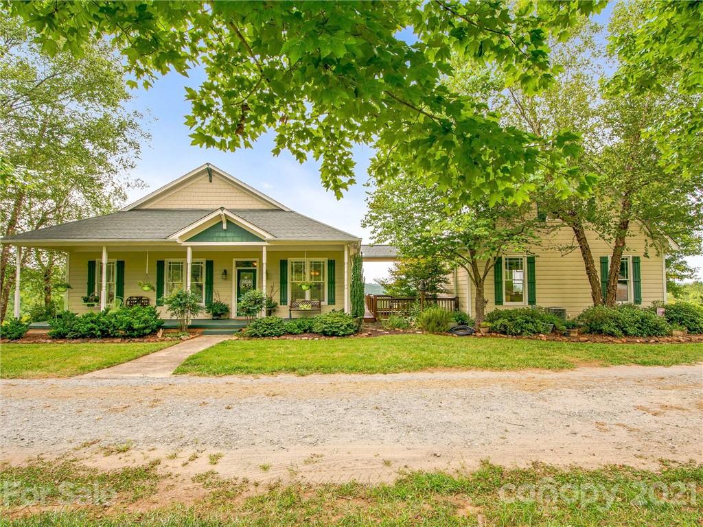 3043 John Watson Road Rutherfordton, NC 28139 - Photo 8 of 48 a front view of a house with a yard and plants