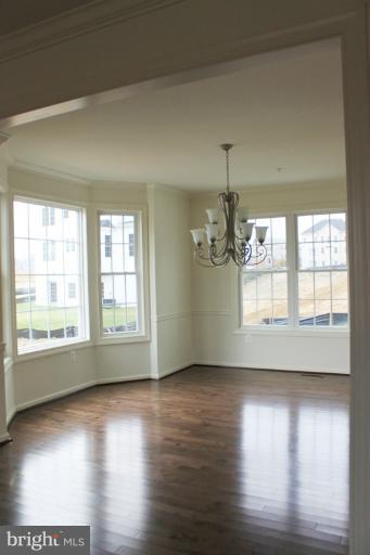 13773 Night Sky Drive Silver Spring, MD 20906 - Photo 18 of 20 a view of empty room with wooden floor and fan