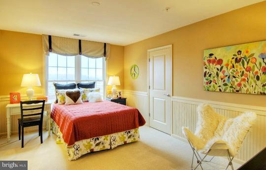 13773 Night Sky Drive Silver Spring, MD 20906 - Photo 3 of 20 a bedroom with a bed and a painting on the wall