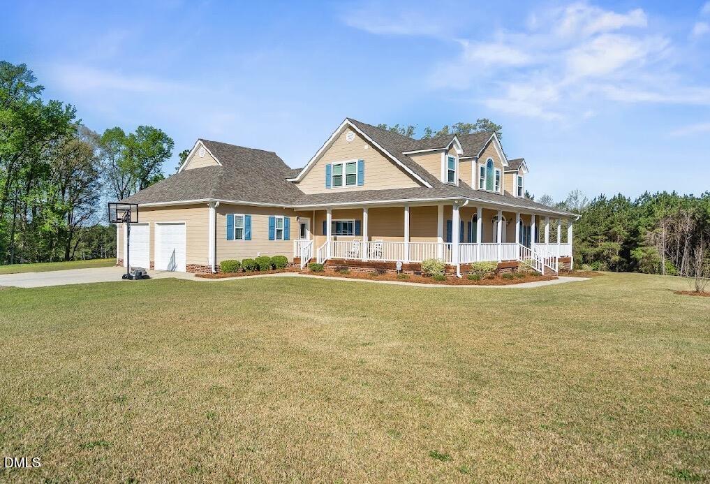 5780 McArthur Road Broadway, NC 27505 - Photo 4 of 40 a front view of a house with swimming pool