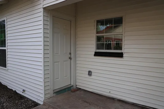 a view of a door and a window