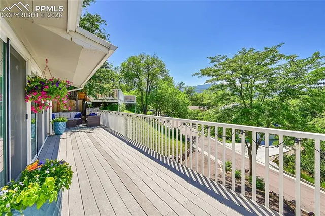 a view of a balcony with chairs