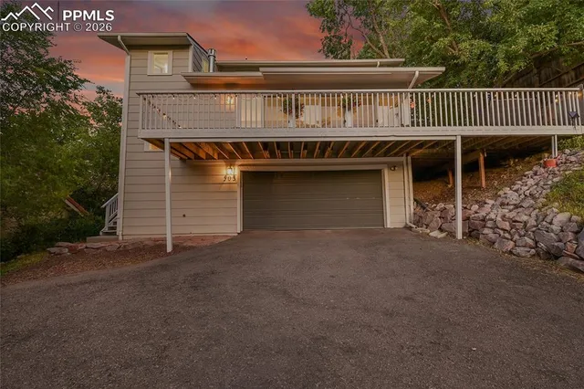 a view of a house with a balcony and deck area