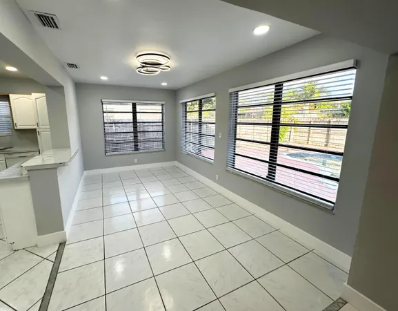 a view of an empty room and window