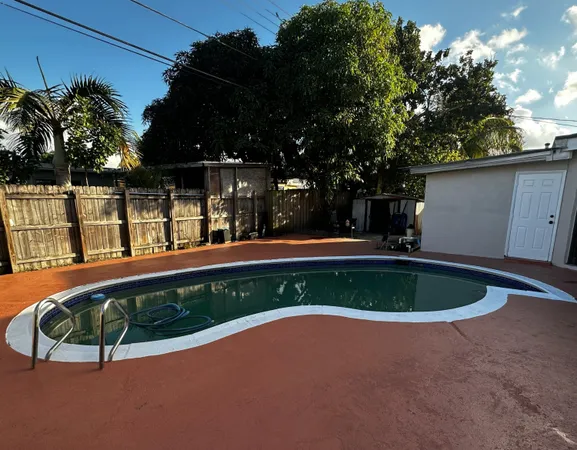 a view of swimming pool from a outdoor space