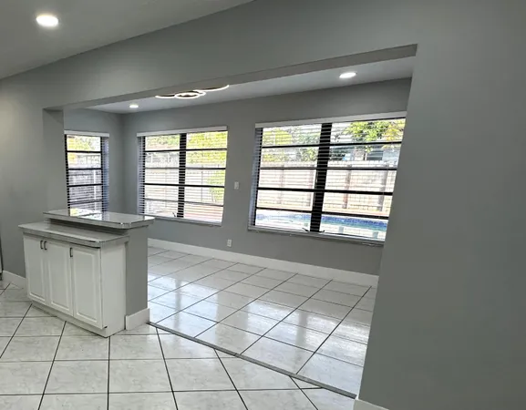 a view of an empty room and window